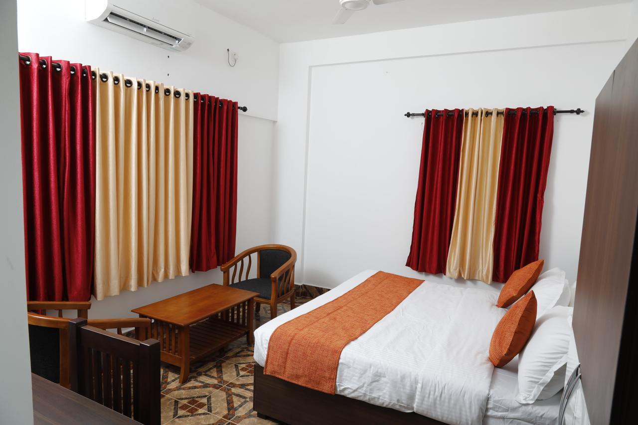 Puthens Clifton Inn Kottayam Buitenkant foto